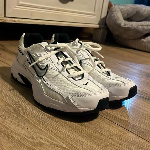 Nike Shoes - Black, White, and silver size eight Nike running shoes.